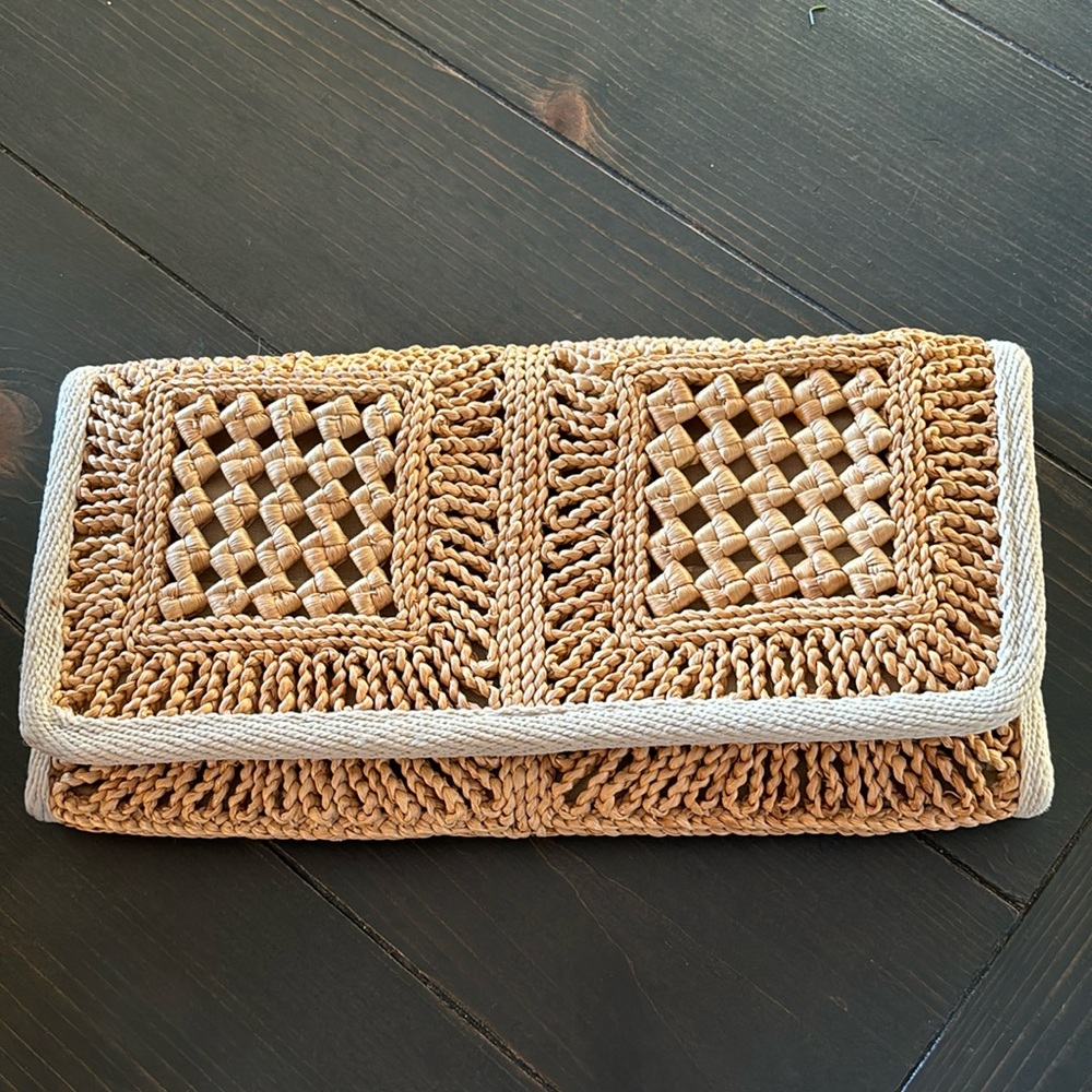 Tan woven clutch. 12 inch 6.25 inch. Good condition.